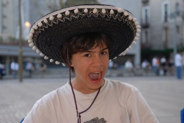 A developer wearing a comic sombrero to indicate they are directly editing code on a live site.
