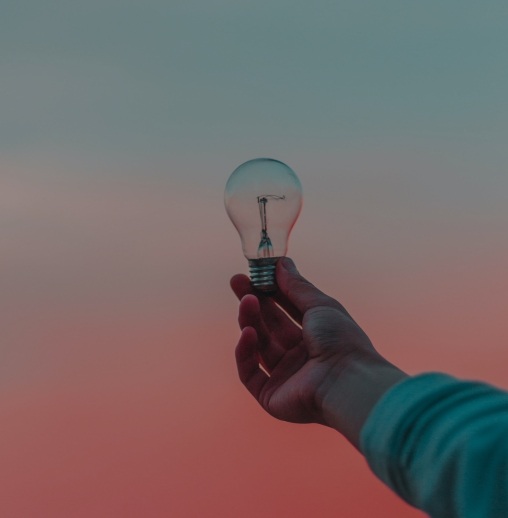 person holding light bulb photo