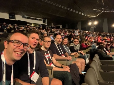 The ComputerMinds talk awaiting a keynote amongst the crowd at Drupalcon Lille 2023